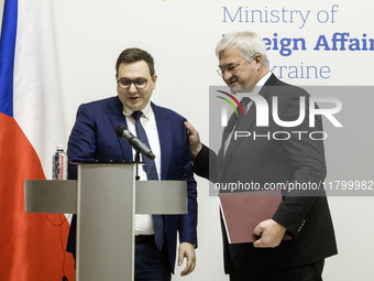 Ukraine's Foreign Minister Andrii Sybiha and Czech Republic's Foreign Minister Jan Lipavsky shake hands after a joint press conference in Ky...