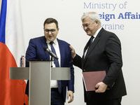 Ukraine's Foreign Minister Andrii Sybiha and Czech Republic's Foreign Minister Jan Lipavsky shake hands after a joint press conference in Ky...