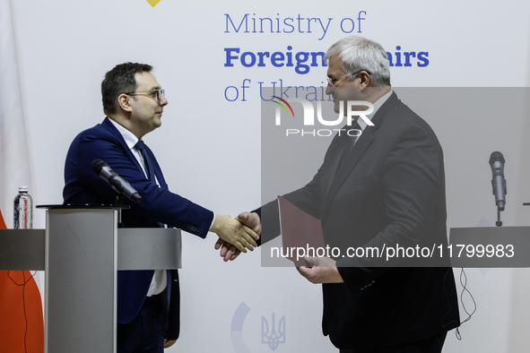 Ukraine's Foreign Minister Andrii Sybiha and Czech Republic's Foreign Minister Jan Lipavsky shake hands after a joint press conference in Ky...