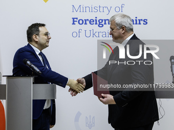 Ukraine's Foreign Minister Andrii Sybiha and Czech Republic's Foreign Minister Jan Lipavsky shake hands after a joint press conference in Ky...