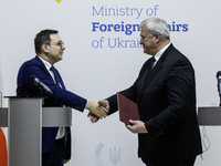 Ukraine's Foreign Minister Andrii Sybiha and Czech Republic's Foreign Minister Jan Lipavsky shake hands after a joint press conference in Ky...