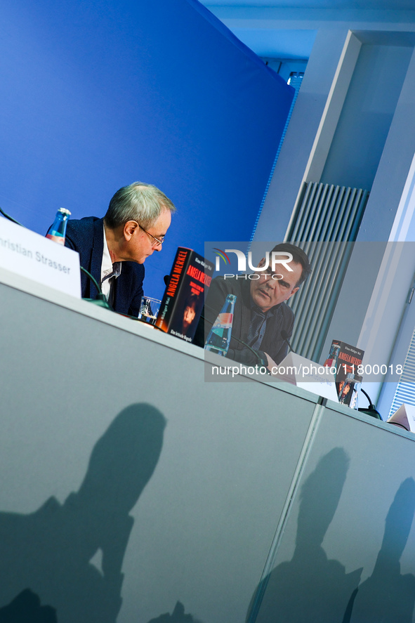 Author Klaus-Rudiger Mai and journalist Uwe Telkamp present the book 'Angela Merkel - Between Legend and Reality' at a press conference in B...