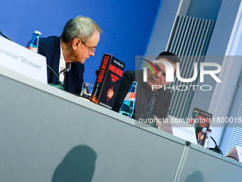 Author Klaus-Rudiger Mai and journalist Uwe Telkamp present the book 'Angela Merkel - Between Legend and Reality' at a press conference in B...