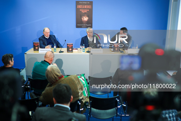 Publisher Christian Strasser, author Klaus-Rudiger Mai, and journalist Uwe Telkamp present the book 'Angela Merkel - Between Legend and Real...