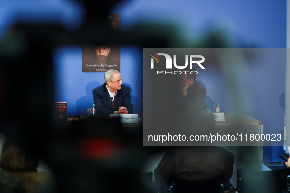 Author Klaus-Rudiger Mai and journalist Uwe Telkamp present the book 'Angela Merkel - Between Legend and Reality' at a press conference in B...