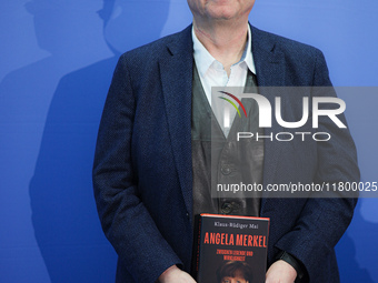 Author Klaus-Rudiger Mai presents his book 'Angela Merkel - Between Legend and Reality' at a press conference in Berlin, Germany, on Novembe...