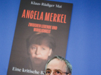 Author Klaus-Rudiger Mai presents his book 'Angela Merkel - Between Legend and Reality' at a press conference in Berlin, Germany, on Novembe...