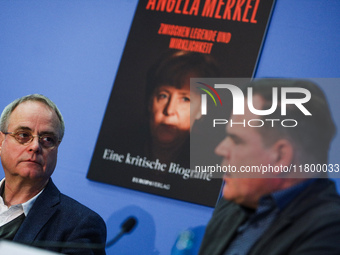 Author Klaus-Rudiger Mai and journalist Uwe Telkamp present the book 'Angela Merkel - Between Legend and Reality' at a press conference in B...