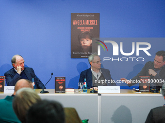 Publisher Christian Strasser, author Klaus-Rudiger Mai, and journalist Uwe Telkamp present the book 'Angela Merkel - Between Legend and Real...