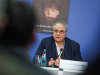 Author Klaus-Rudiger Mai presents his book 'Angela Merkel - Between Legend and Reality' at a press conference in Berlin, Germany, on Novembe...