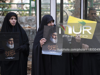 Veiled Iranian women hold portraits of Lebanon's Hezbollah leader, Hassan Nasrallah, during an anti-Israeli rally in front of the United Nat...