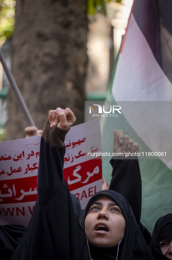 Veiled Iranian women shout anti-UN, anti-U.S., and anti-Israeli slogans during an anti-Israeli rally in front of the United Nations office i...