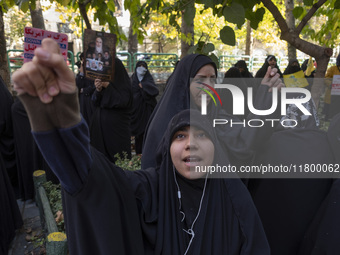 Veiled Iranian women shout anti-UN, anti-U.S., and anti-Israeli slogans during an anti-Israeli rally in front of the United Nations office i...