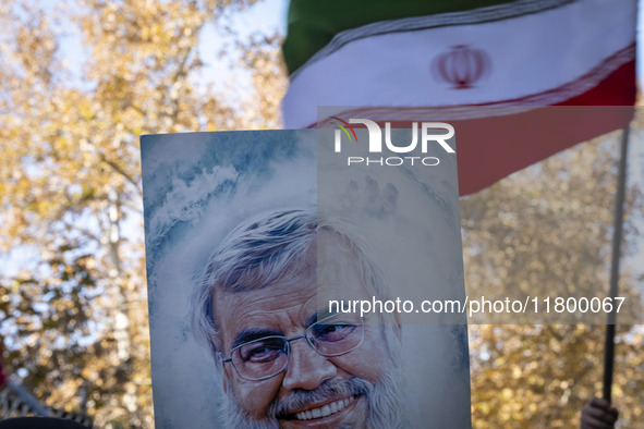 An Iranian protester (not pictured) holds a portrait of Lebanon's Hezbollah late leader, Hassan Nasrallah, who was killed in an Israeli airs...