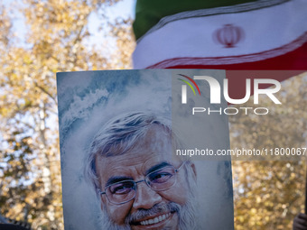 An Iranian protester (not pictured) holds a portrait of Lebanon's Hezbollah late leader, Hassan Nasrallah, who was killed in an Israeli airs...