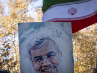 An Iranian protester (not pictured) holds a portrait of Lebanon's Hezbollah late leader, Hassan Nasrallah, who was killed in an Israeli airs...