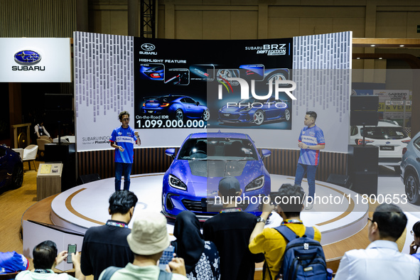 Ismail Ashlan, Marketing Communications Manager, Subaru Indonesia (R), explains the Subaru BRZ Drift Edition during The Gaikindo Jakarta Aut...