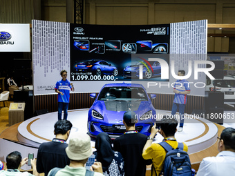 Ismail Ashlan, Marketing Communications Manager, Subaru Indonesia (R), explains the Subaru BRZ Drift Edition during The Gaikindo Jakarta Aut...