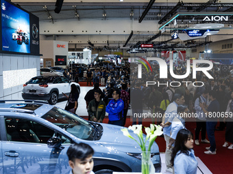 Visitors look at vehicles displayed during The Gaikindo Jakarta Auto Week in Tangerang, Indonesia, on November 22, 2024. The show, the natio...