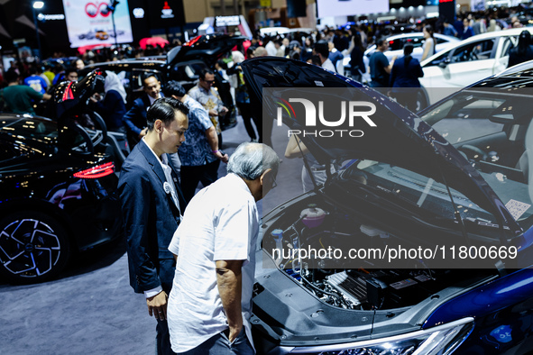 Visitors look at BYD's electric vehicles displayed during The Gaikindo Jakarta Auto Week in Tangerang, Indonesia, on November 22, 2024. The...