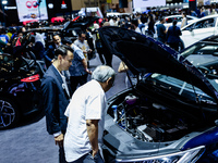 Visitors look at BYD's electric vehicles displayed during The Gaikindo Jakarta Auto Week in Tangerang, Indonesia, on November 22, 2024. The...