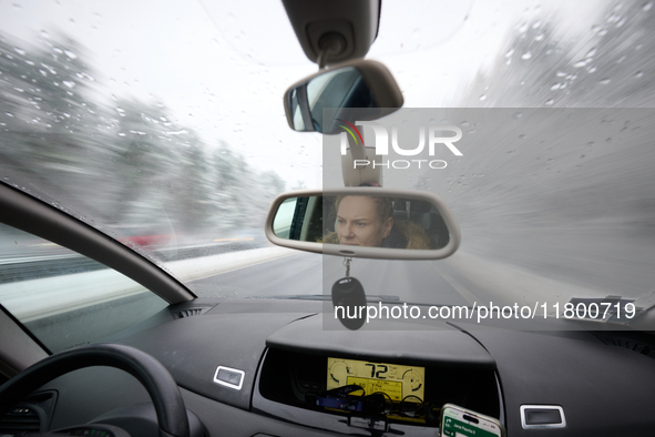 A driver is seen during snowfall in Warsaw, Poland on 22 November, 2024. 