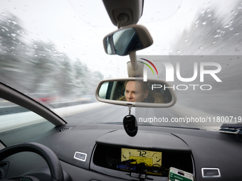 A driver is seen during snowfall in Warsaw, Poland on 22 November, 2024. (