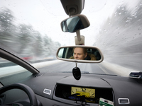 A driver is seen during snowfall in Warsaw, Poland on 22 November, 2024. (