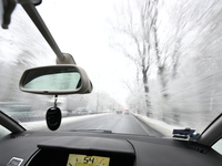 A tree lined road with snow is seen in Warsaw, Poland on 22 November, 2024. (