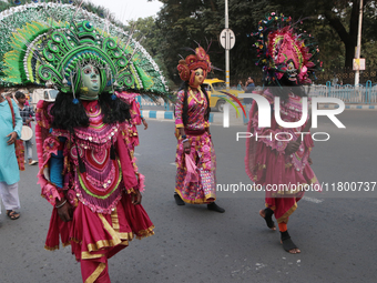 Indian tribal Chaw artists from Purulia walk on a street during the West Bengal Government-hosted ''Jangalmahal Utsav'' in Kolkata, India, o...