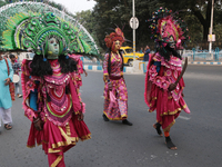 Indian tribal Chaw artists from Purulia walk on a street during the West Bengal Government-hosted ''Jangalmahal Utsav'' in Kolkata, India, o...