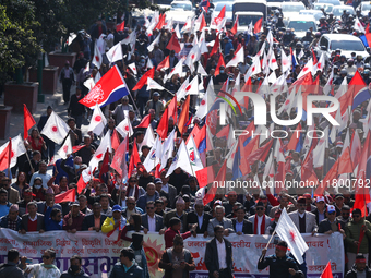 Cadres and supporters of CPN-UML hold a rally in the streets of Kathmandu as they take part in the show of power called by the party in Kath...