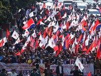 Cadres and supporters of CPN-UML hold a rally in the streets of Kathmandu as they take part in the show of power called by the party in Kath...