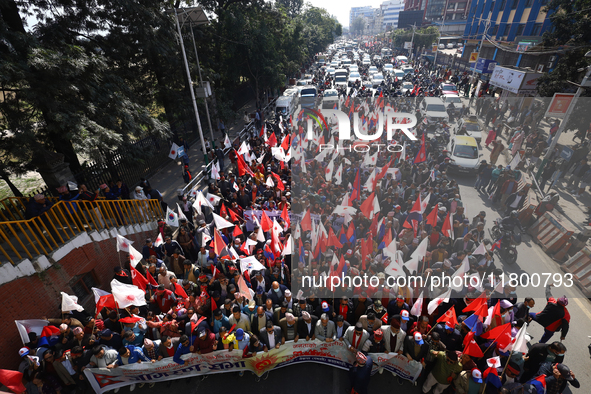 Cadres and supporters of CPN-UML hold a rally in the streets of Kathmandu as they take part in the show of power called by the party in Kath...