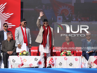 Nepal Prime Minister KP Sharma Oli (center) waves towards the party cadres and supporters during a rally in Kathmandu, Nepal, on November 22...