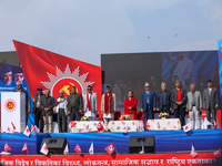 Nepal Prime Minister KP Sharma Oli (center) stands in line with other CPN-UML party leaders during a mass gathering ceremony in Kathmandu, N...