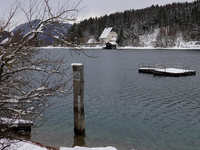 In the village of Walchensee in Upper Bavaria, in the district of Bad Tolz-Wolfratshausen, on the shores of Lake Walchensee, a winter atmosp...