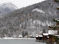 In the village of Walchensee in Upper Bavaria, in the district of Bad Tolz-Wolfratshausen, on the shores of Lake Walchensee, a winter atmosp...