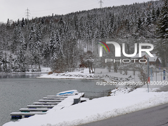 In the village of Walchensee in Upper Bavaria, in the district of Bad Tolz-Wolfratshausen, on the shores of Lake Walchensee, a winter atmosp...