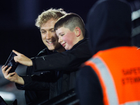 Cameron Hutchison of Newcastle Falcons takes a quick selfie with a fan before the Premiership Cup Group A match between Newcastle Falcons an...