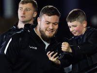 Murray McCallum of Newcastle Falcons takes a quick selfie with a fan before the Premiership Cup Group A match between Newcastle Falcons and...