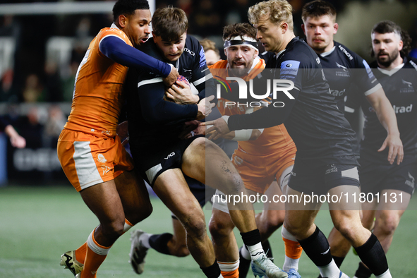 Ben Stevenson of Newcastle Falcons is in action as he is tackled by Obi Ene during the Premiership Cup Group A match between Newcastle Falco...