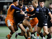 Ben Stevenson of Newcastle Falcons is in action as he is tackled by Obi Ene during the Premiership Cup Group A match between Newcastle Falco...