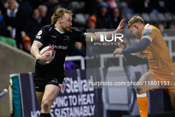 Tom Gordon of Newcastle Falcons fends to score during the Premiership Cup Group A match between Newcastle Falcons and Sale FC at Kingston Pa...