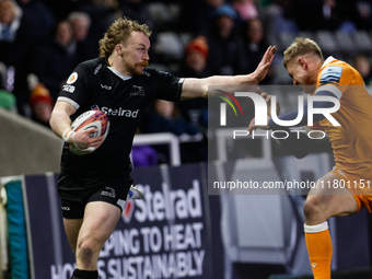 Tom Gordon of Newcastle Falcons fends to score during the Premiership Cup Group A match between Newcastle Falcons and Sale FC at Kingston Pa...