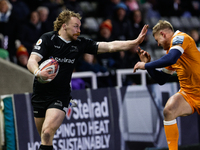 Tom Gordon of Newcastle Falcons fends to score during the Premiership Cup Group A match between Newcastle Falcons and Sale FC at Kingston Pa...