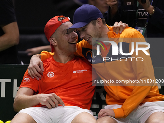 MALAGA, SPAIN - NOVEMBER 22: Tallon Griekspoor of Team Netherlands celebrates the victory with Botic van de Zandschulp after winning his sin...