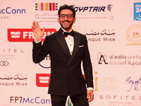 Movie star Ahmed Helmy is on the red carpet at the conclusion of the Cairo Film Festival in its 45th session, held at the Egyptian Opera Hou...