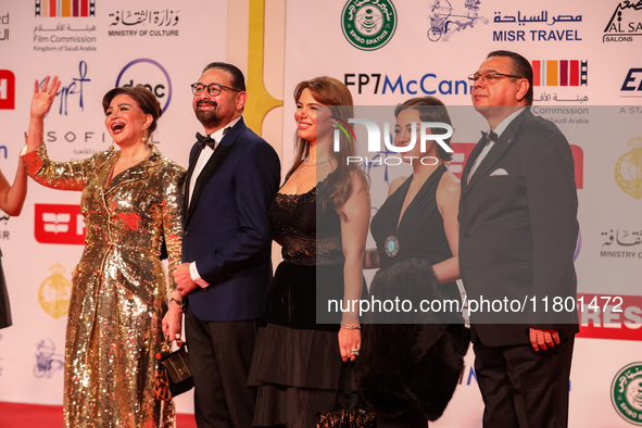 Movie star Alham Shahen and her family stand on the red carpet at the conclusion of the Cairo Film Festival in its 45th session, held at the...