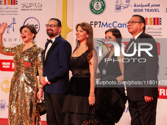 Movie star Alham Shahen and her family stand on the red carpet at the conclusion of the Cairo Film Festival in its 45th session, held at the...